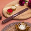 Personalized leather bracelet with name on wooden board