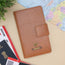 Tan family passport cover