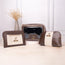 Brown and beige leather makeup pouches with zip closure and name