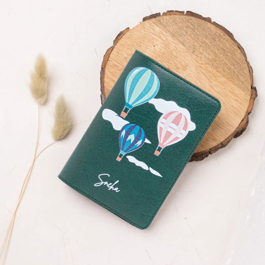 Personalised green passport cover with balloon design