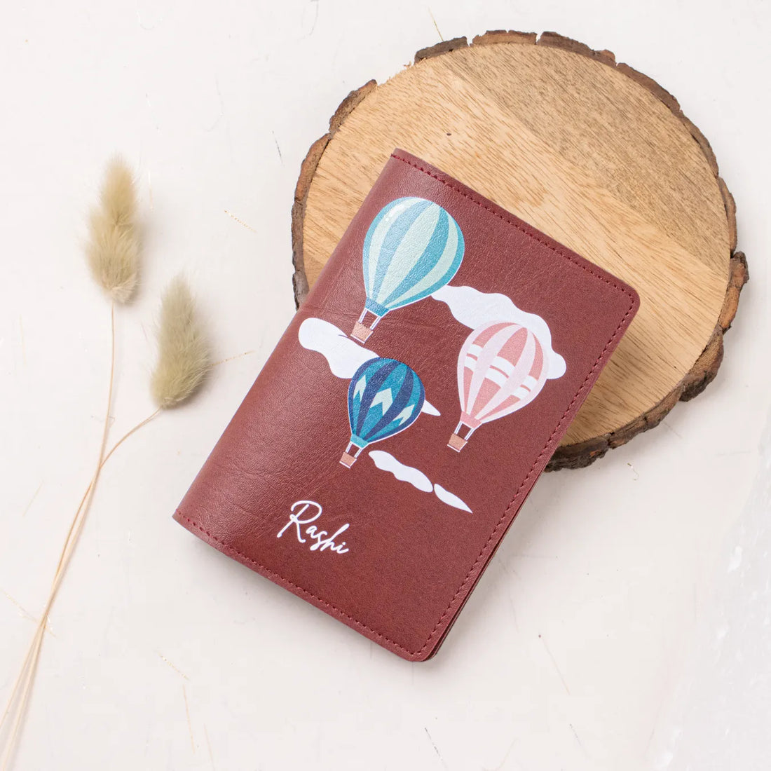 Personalised maroon passport cover with balloon design