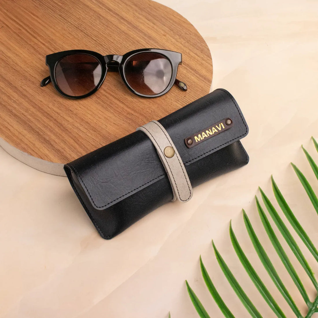 Black personalised sunglass case with sunglasses