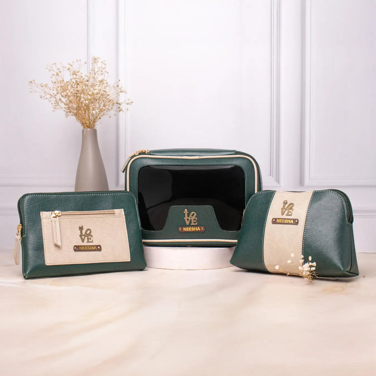 Personalised vanity kit set with green makeup pouches displayed on a tabletop