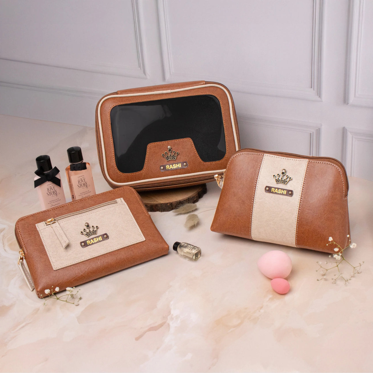 Personalised vanity kit set with tan makeup pouches and cosmetic items displayed