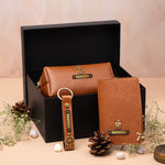 Brown leather keychain and pouch gift set arranged in a black box