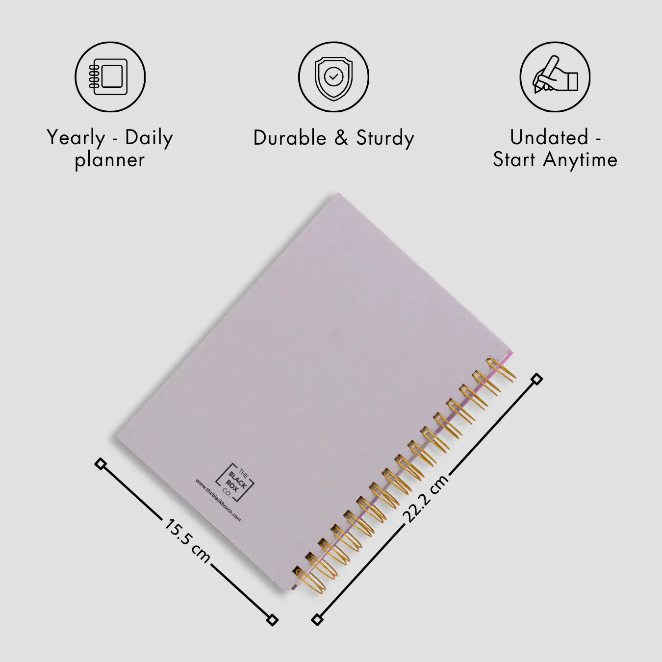 Light pink spiral planner with gold rings