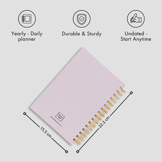 Light pink spiral planner with gold rings