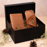 Brown leather wallet and sunglass case displayed in a black gift box