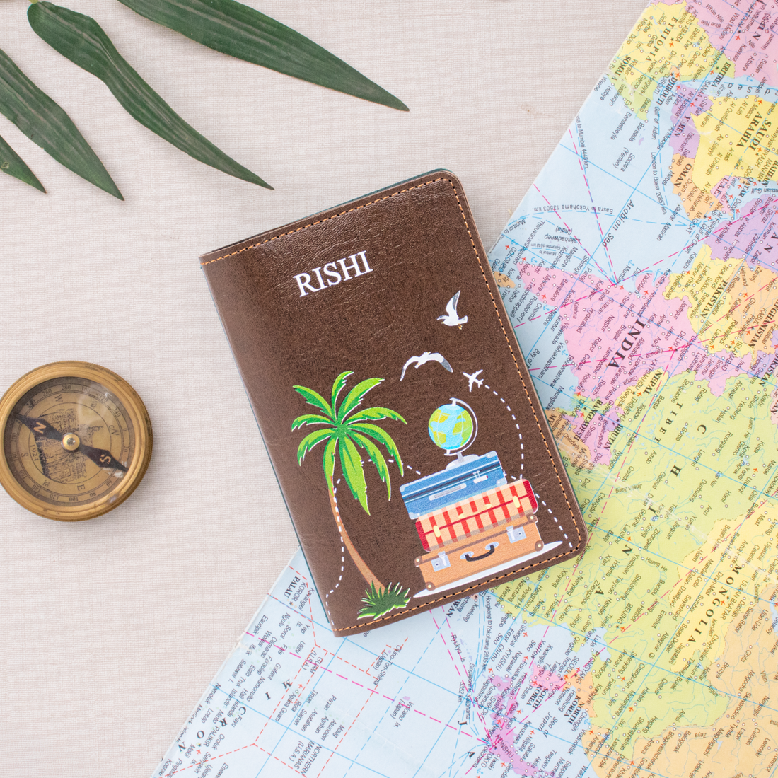 Brown personalized passport cover on a world map