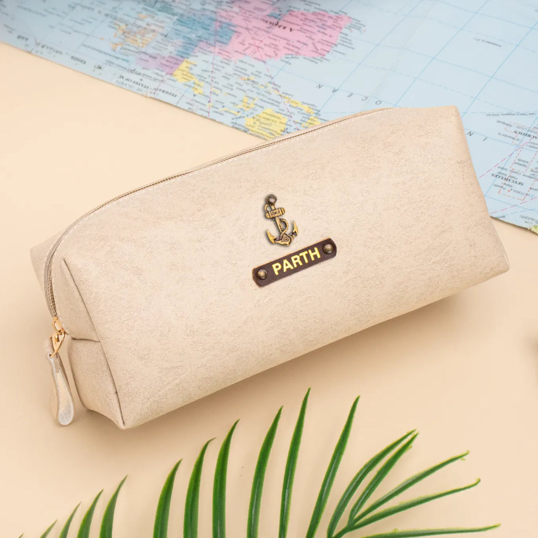 Beige travel pouch with charm