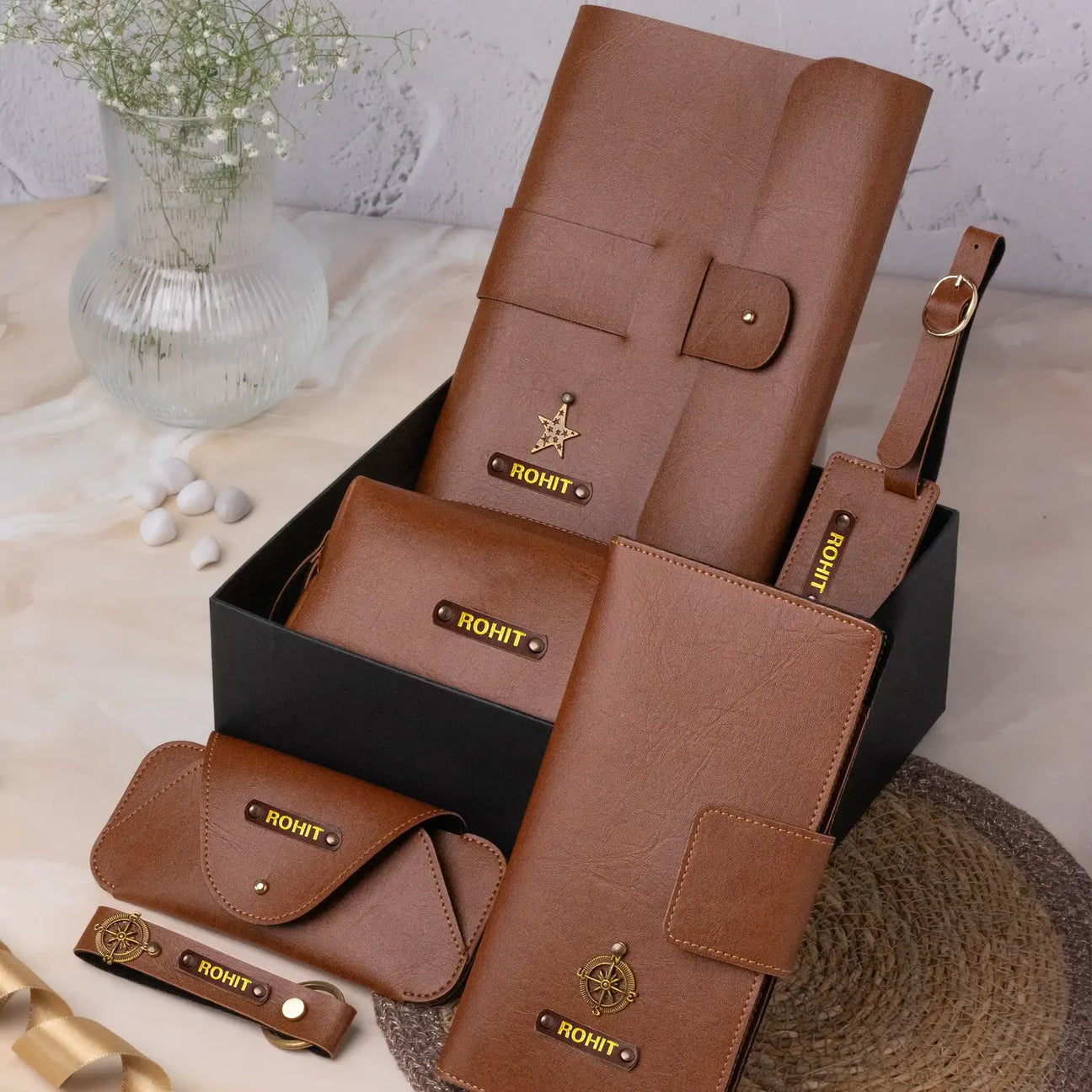 Brown leather personalised gift set with multiple accessories in a black box