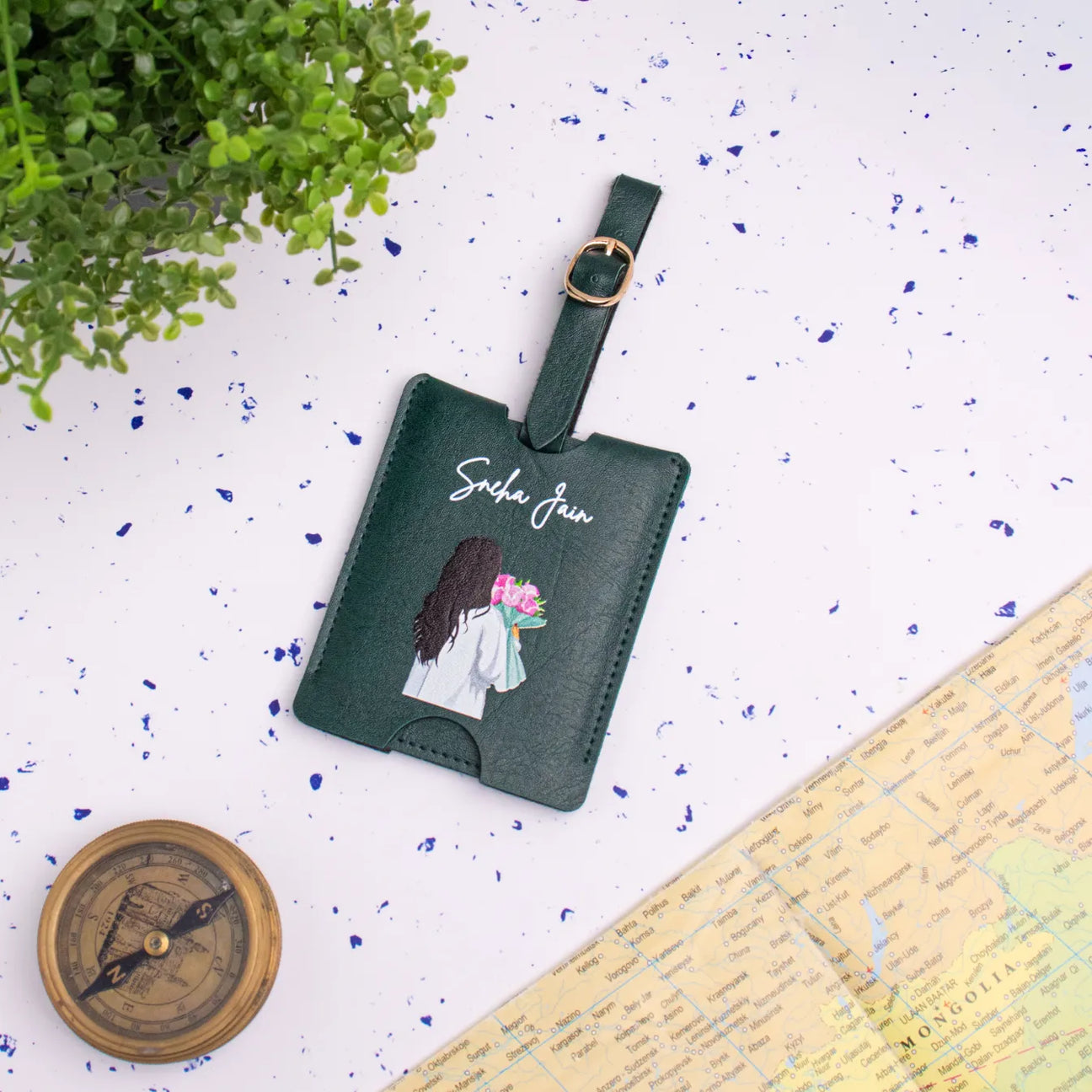 Green personalised travel tag on map backdrop