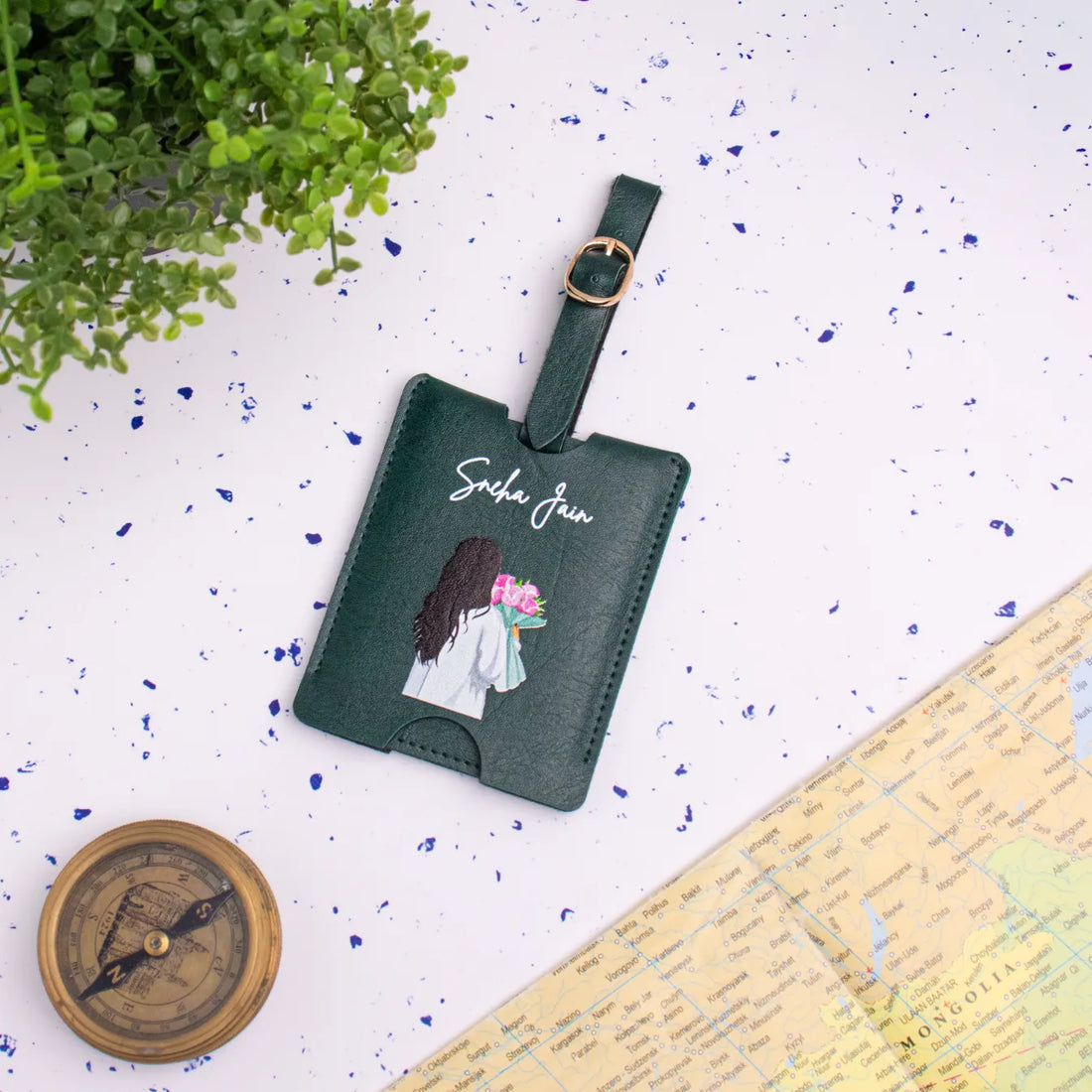 Green personalised travel tag on map backdrop