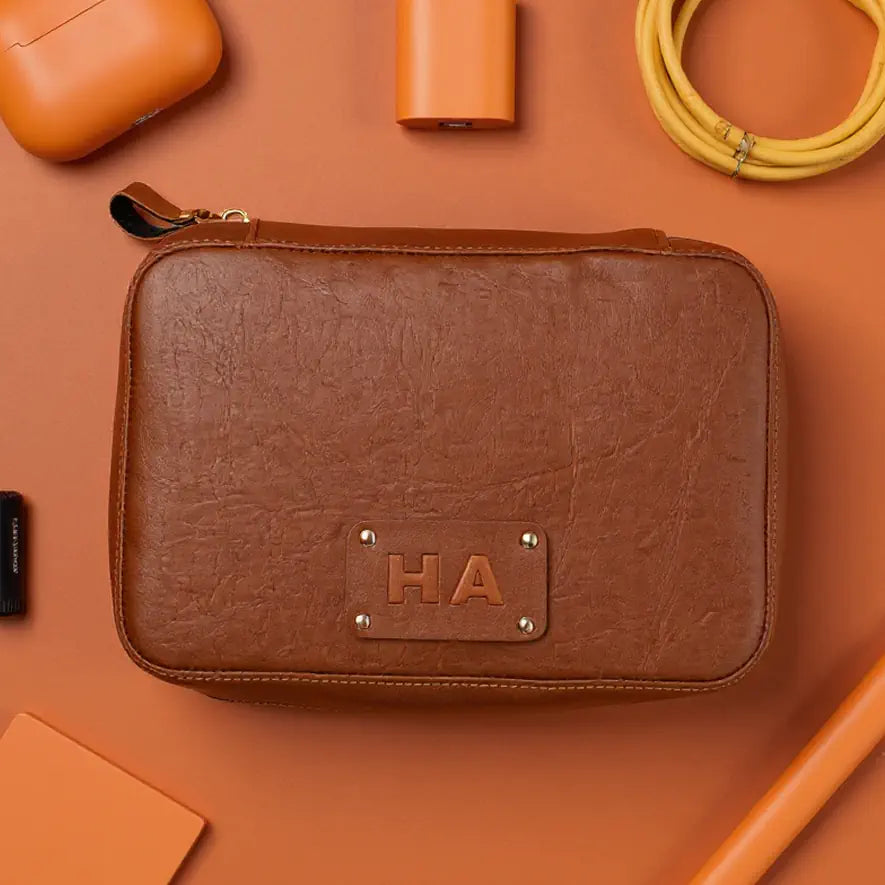 Brown leather pouch with HA monogram