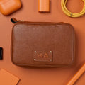 Brown leather pouch with HA monogram