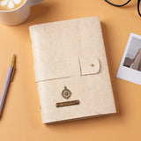 Beige diary with pen