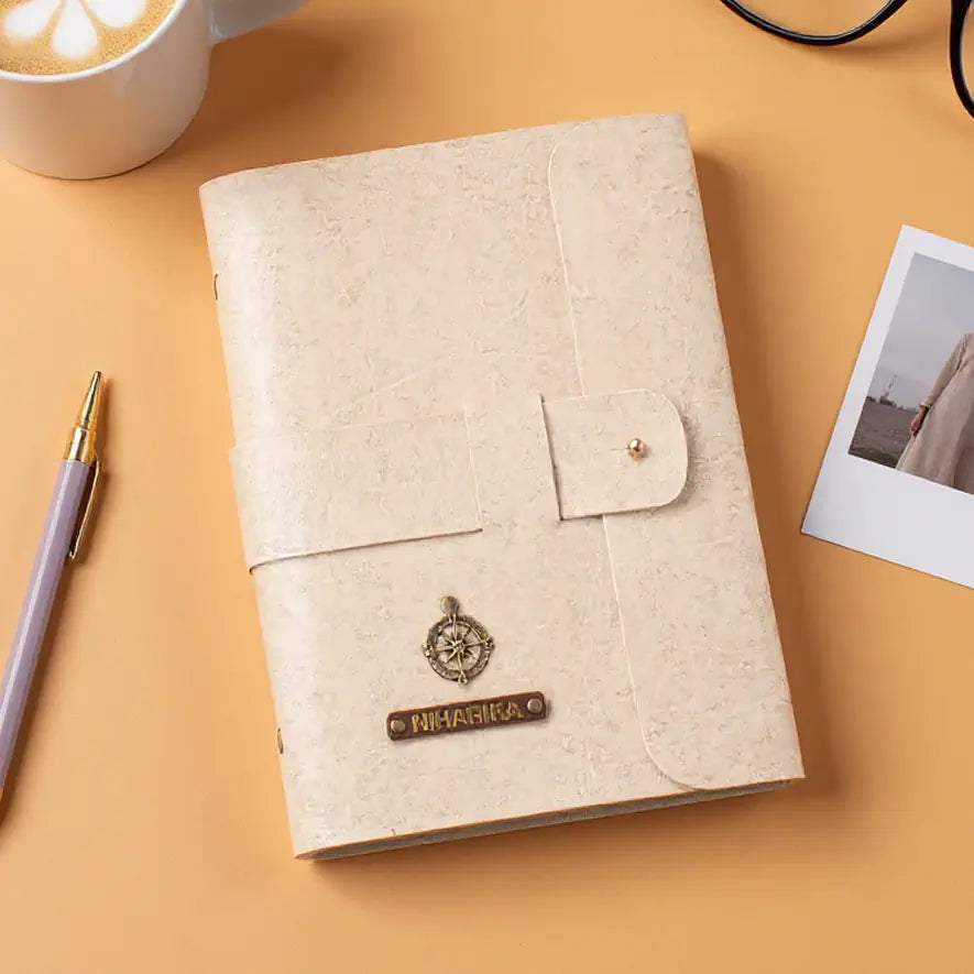 Beige diary with pen