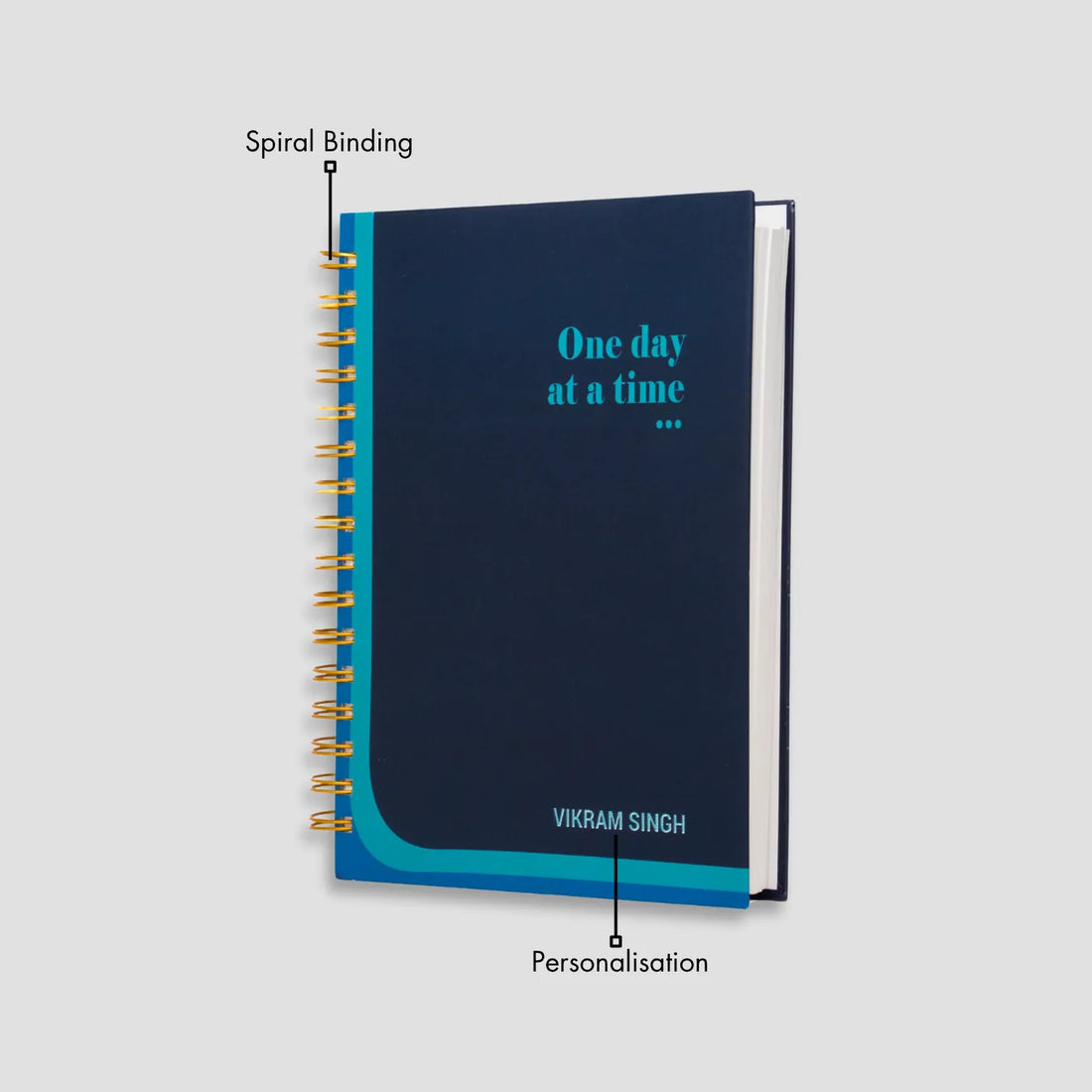 Navy spiral notebook with name 'Vikram Singh'