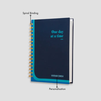 Navy spiral notebook with name 'Vikram Singh'