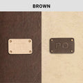 Brown leather texture with engraved metal logo plates