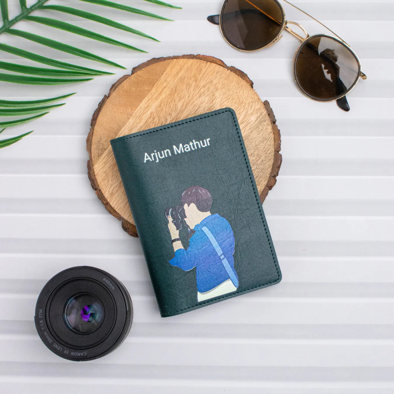 Green travel pouch flatlay with camera gear