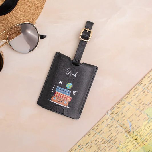 Personalised black luggage tag on travel background