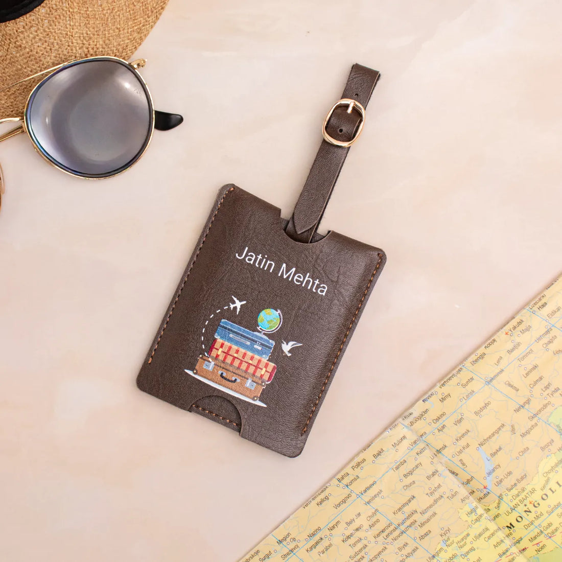 Brown travel-themed luggage tag