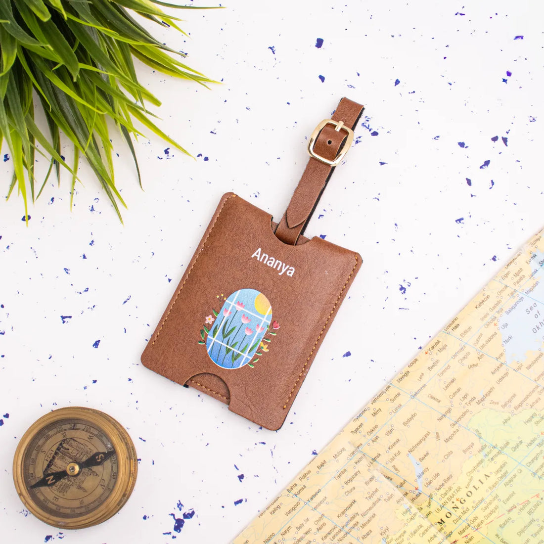 Personalised tan luggage tag on travel background